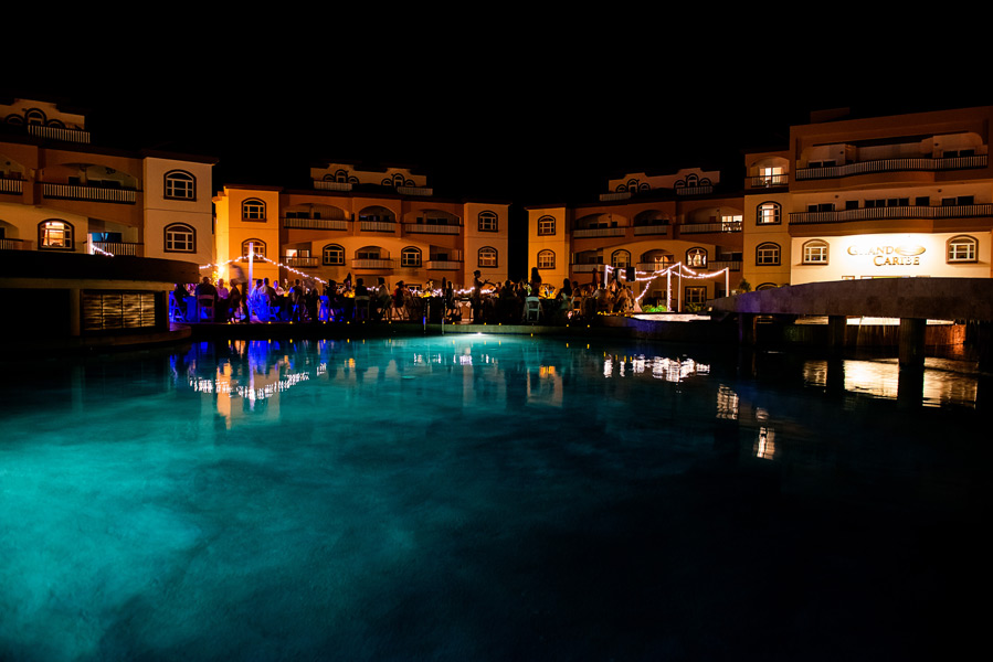 Poolside Wedding Reception. Grand Caribe Belize wedding. Wedding Photography by Leonardo Melendez Photography.