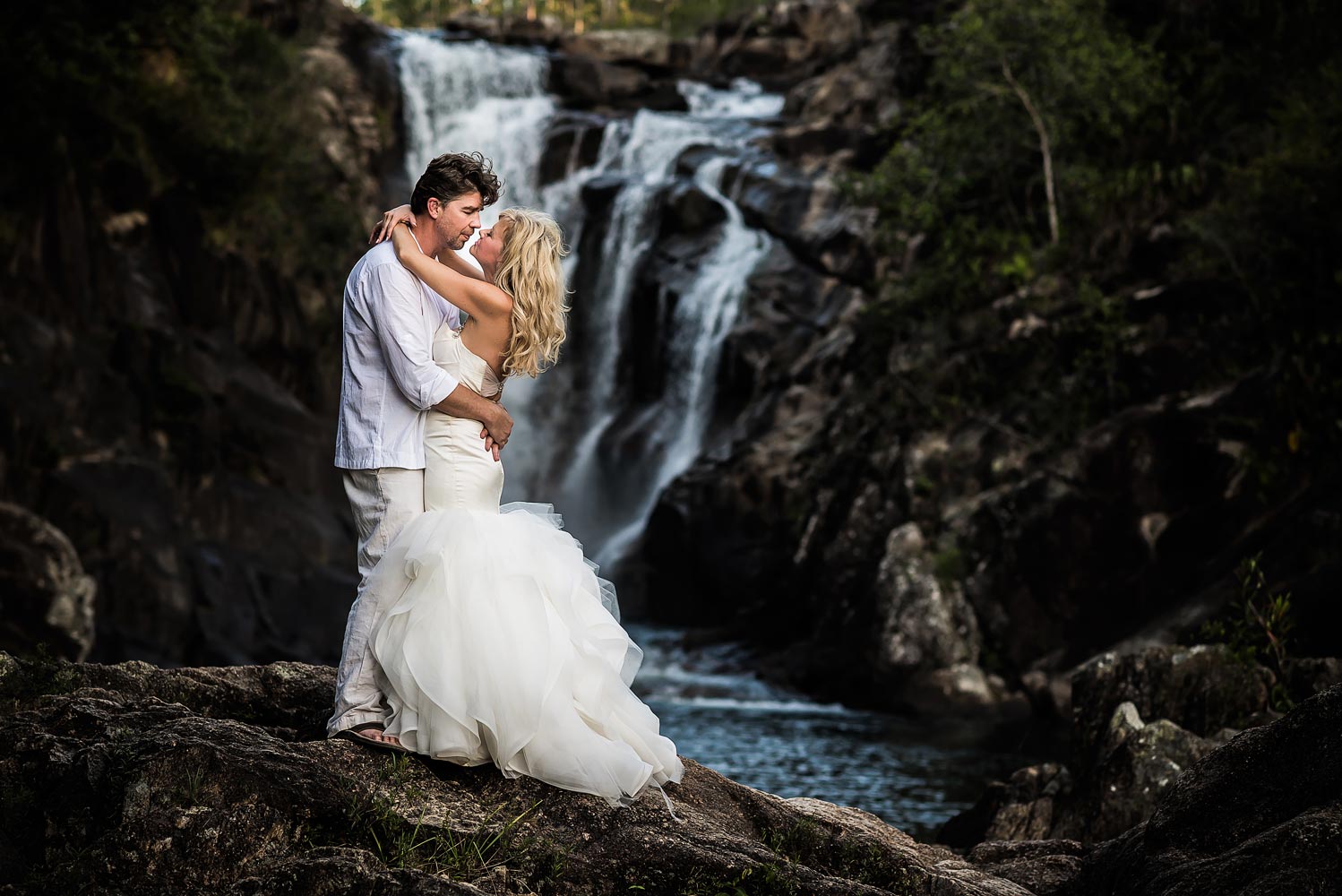 trashing the dress off a waterfall in belize